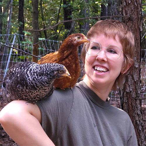 Rachel hang out with Oprah and Seven,  two chickens on her shoulder.